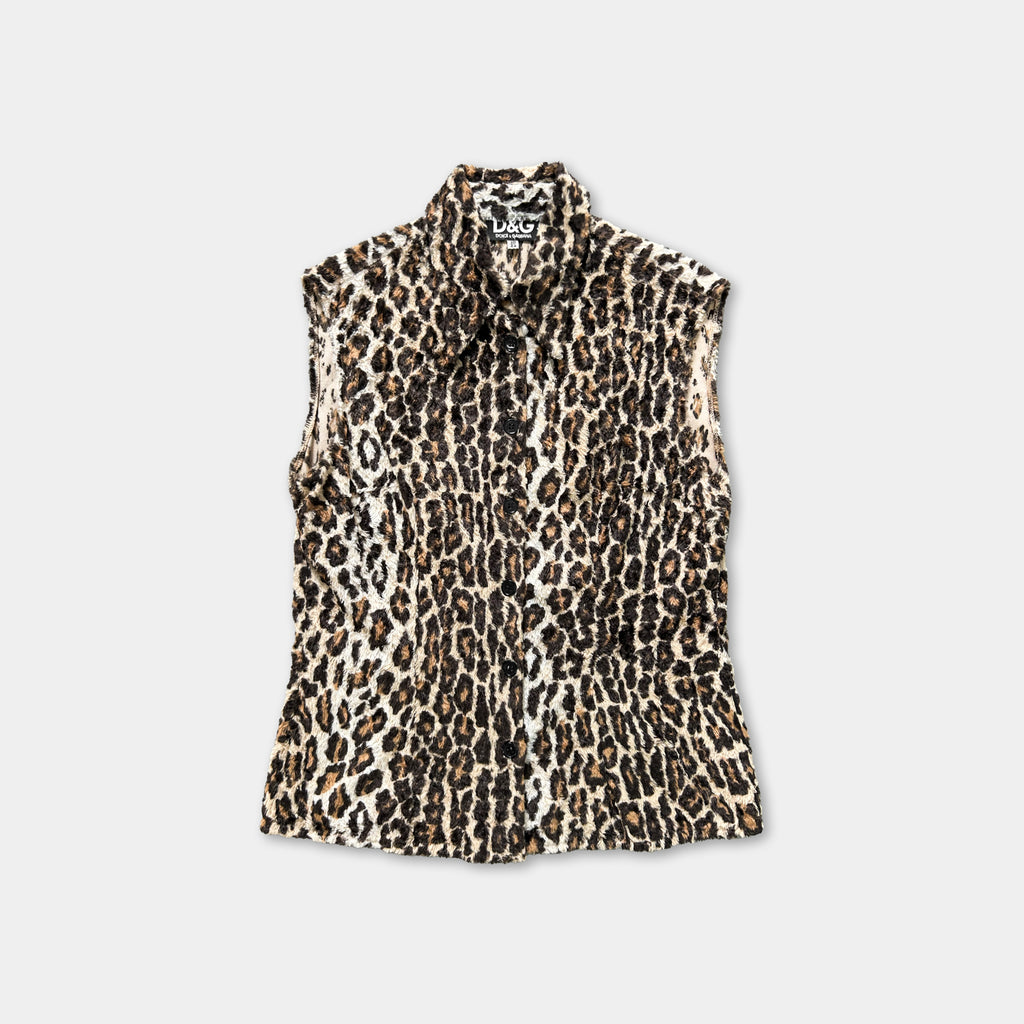 A leopard print sleeveless shirt is displayed against a white background.