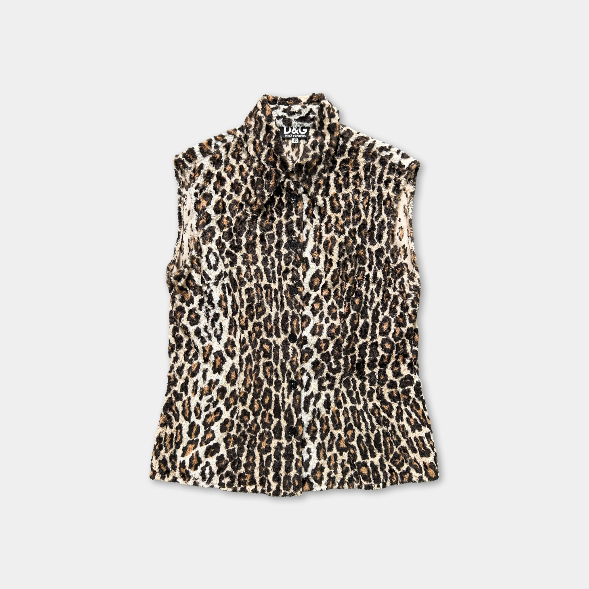 A leopard print sleeveless shirt is displayed against a white background.