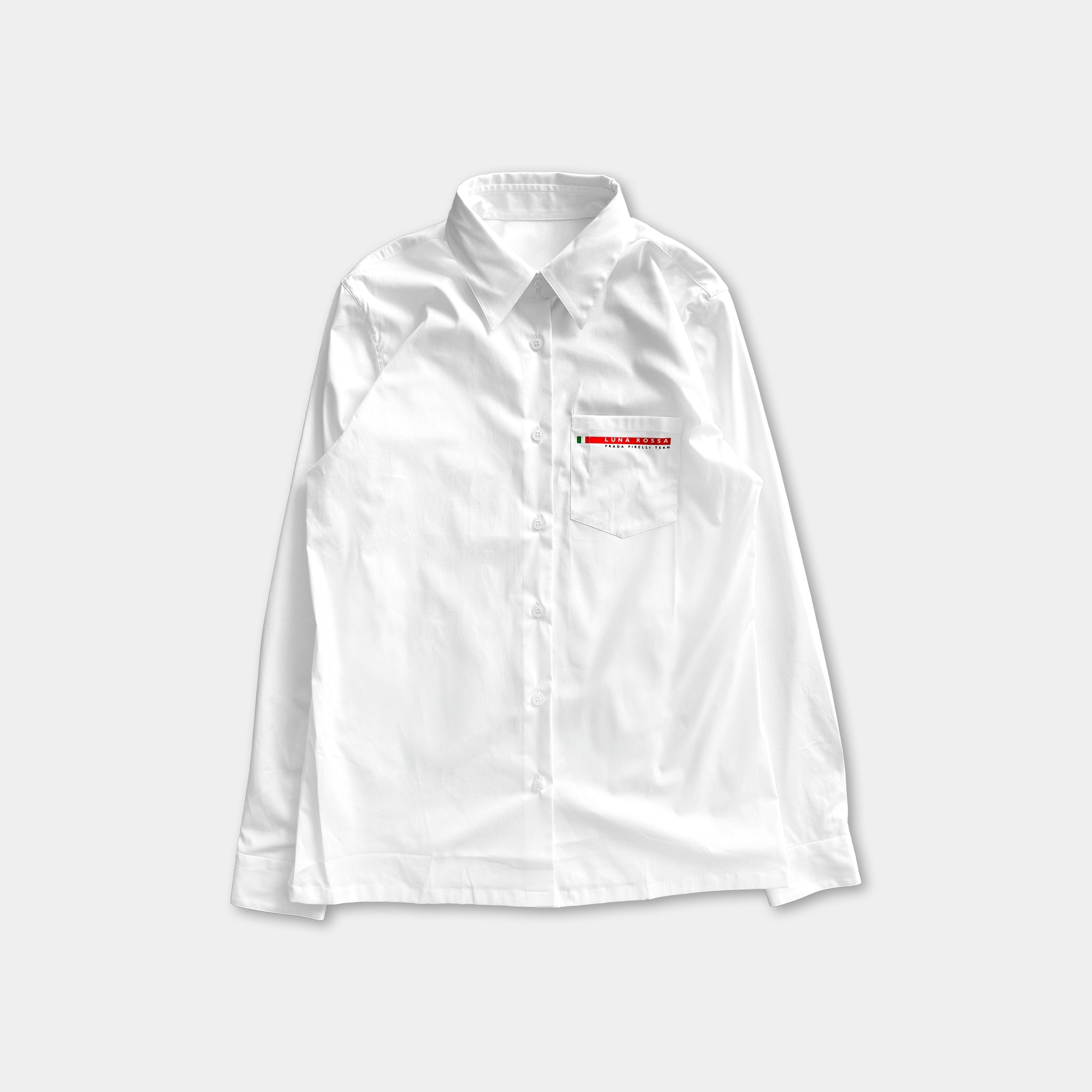 A white collared shirt with a red logo on the left side of the chest.