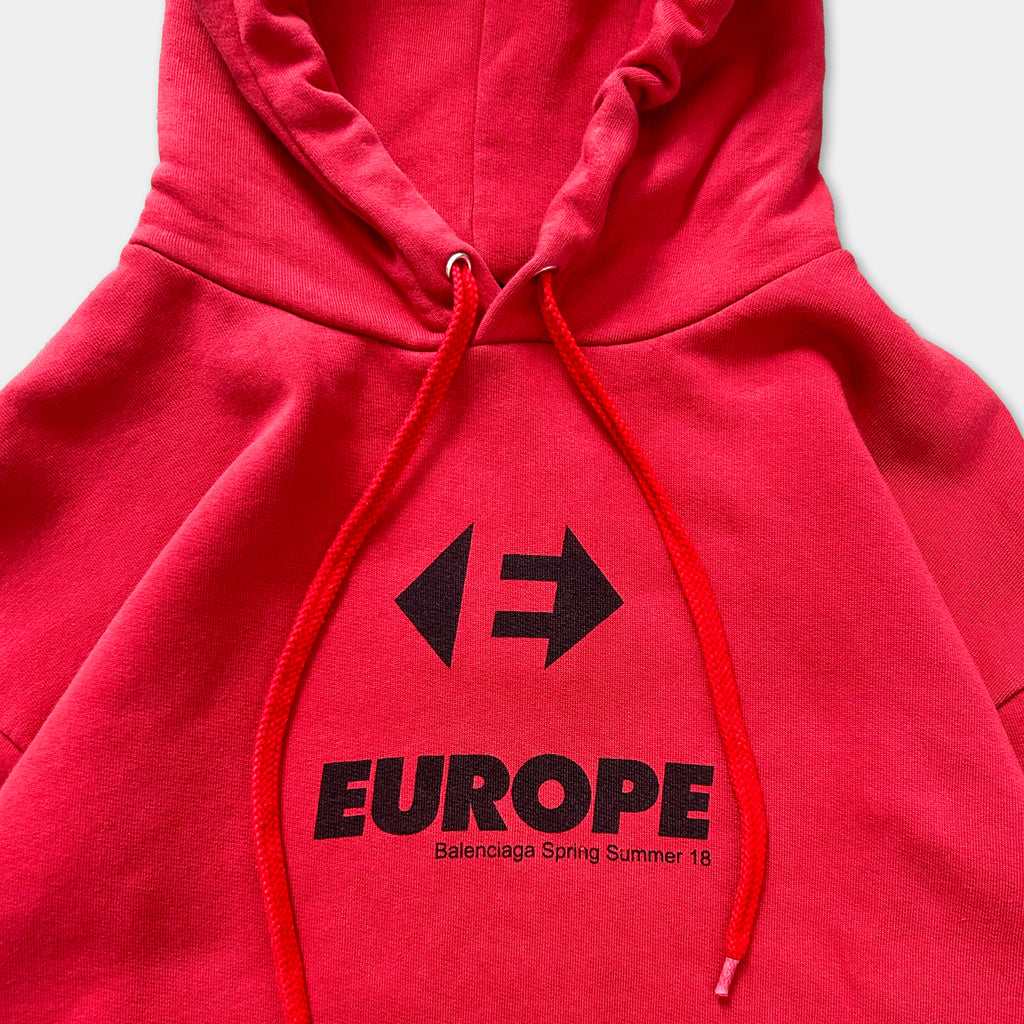 A red hoodie with the text "EUROPE" and a graphic design printed on it.