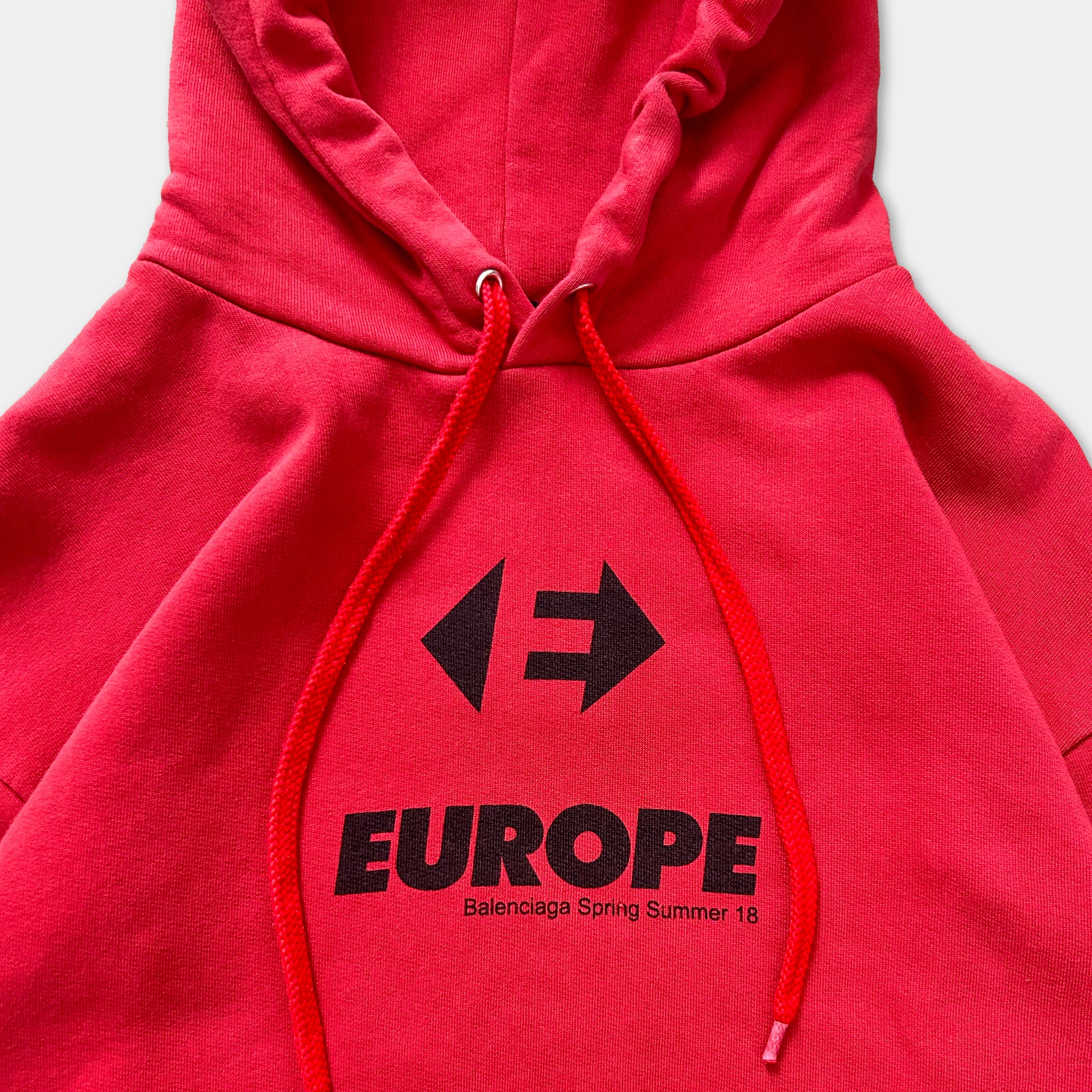 A red hoodie with the text "EUROPE" and a graphic design printed on it.