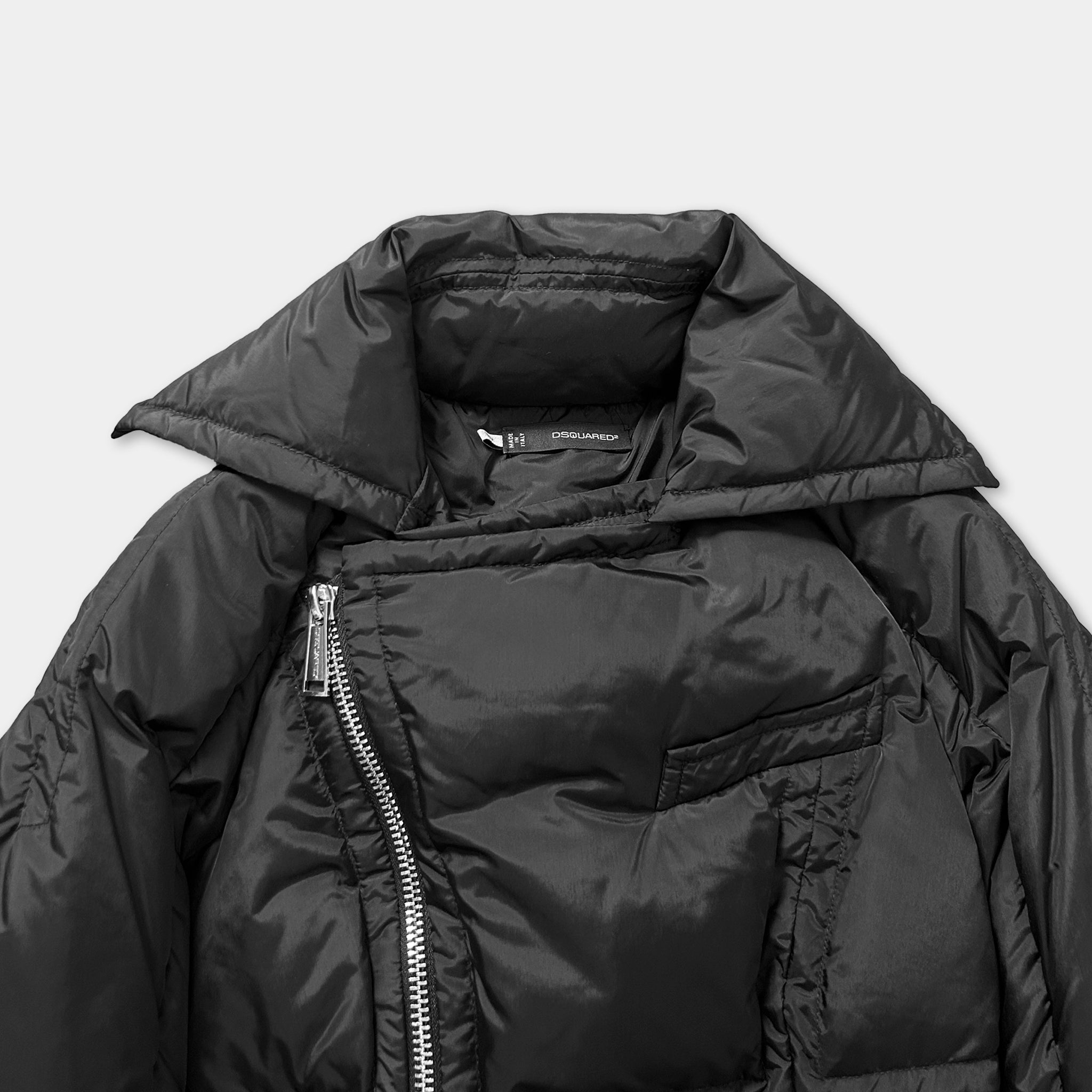 A black puffy jacket with a zipper and collar, displayed against a white background.