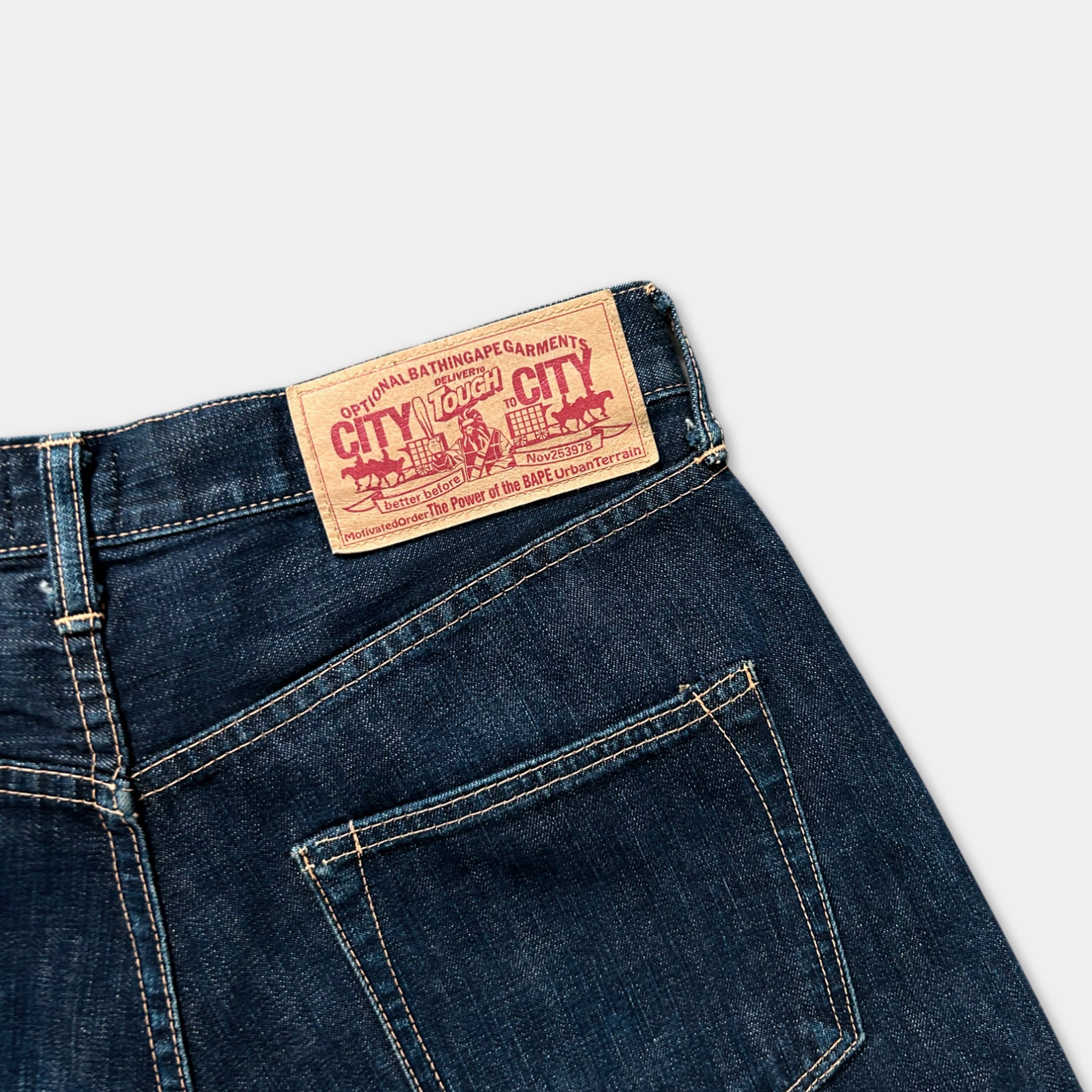 A pair of blue jeans with a red and white label on the back pocket.