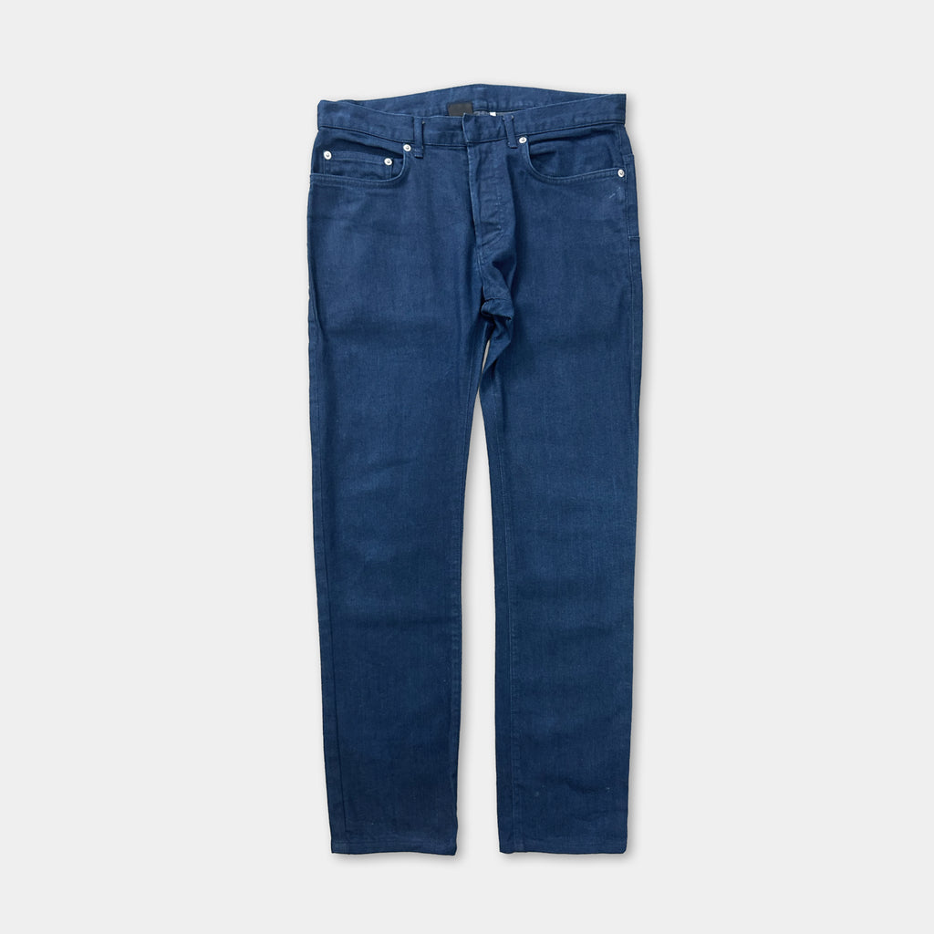 A pair of blue jeans with a button closure.