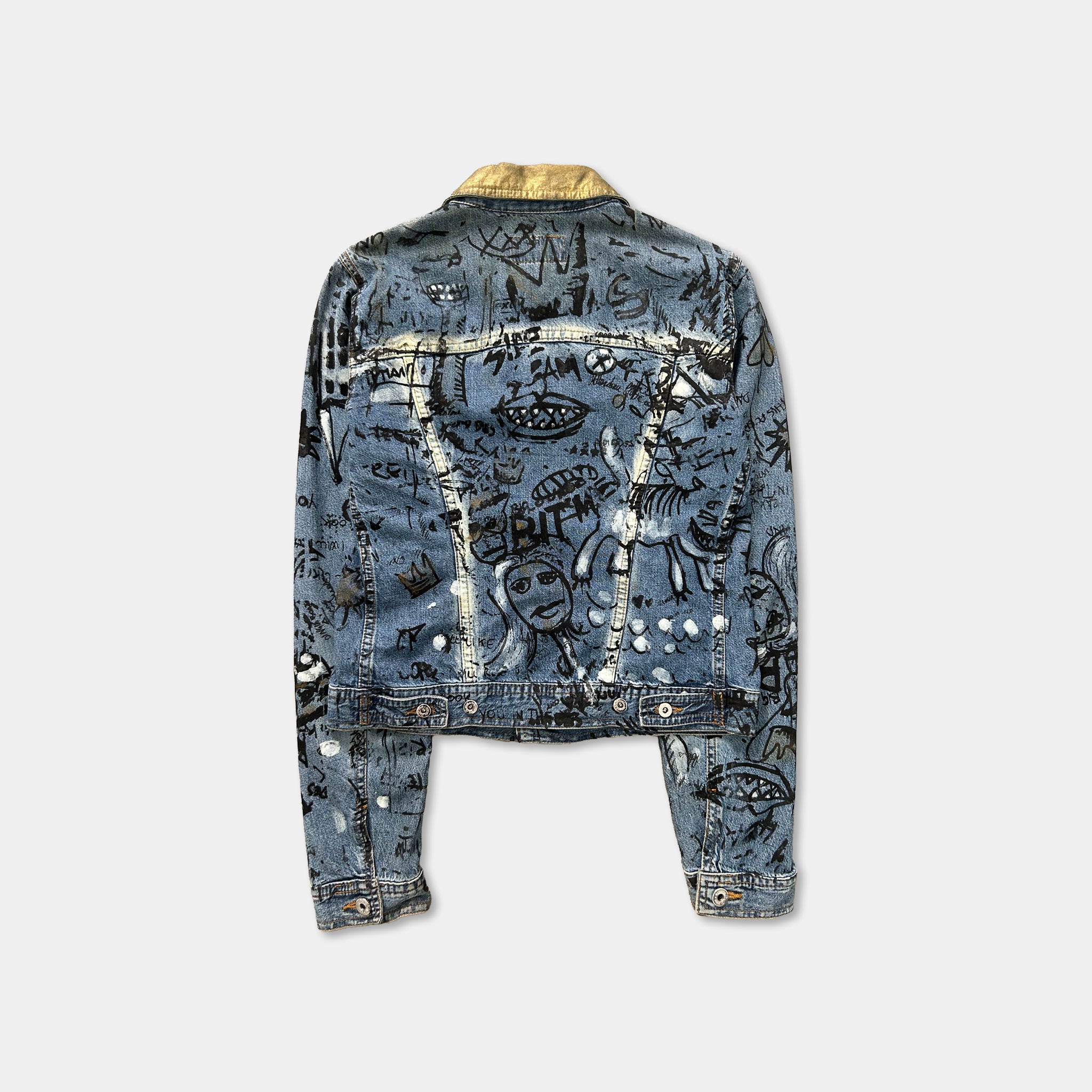 a denim jacket with a unique and artistic design, including various graffiti-style illustrations and patterns.