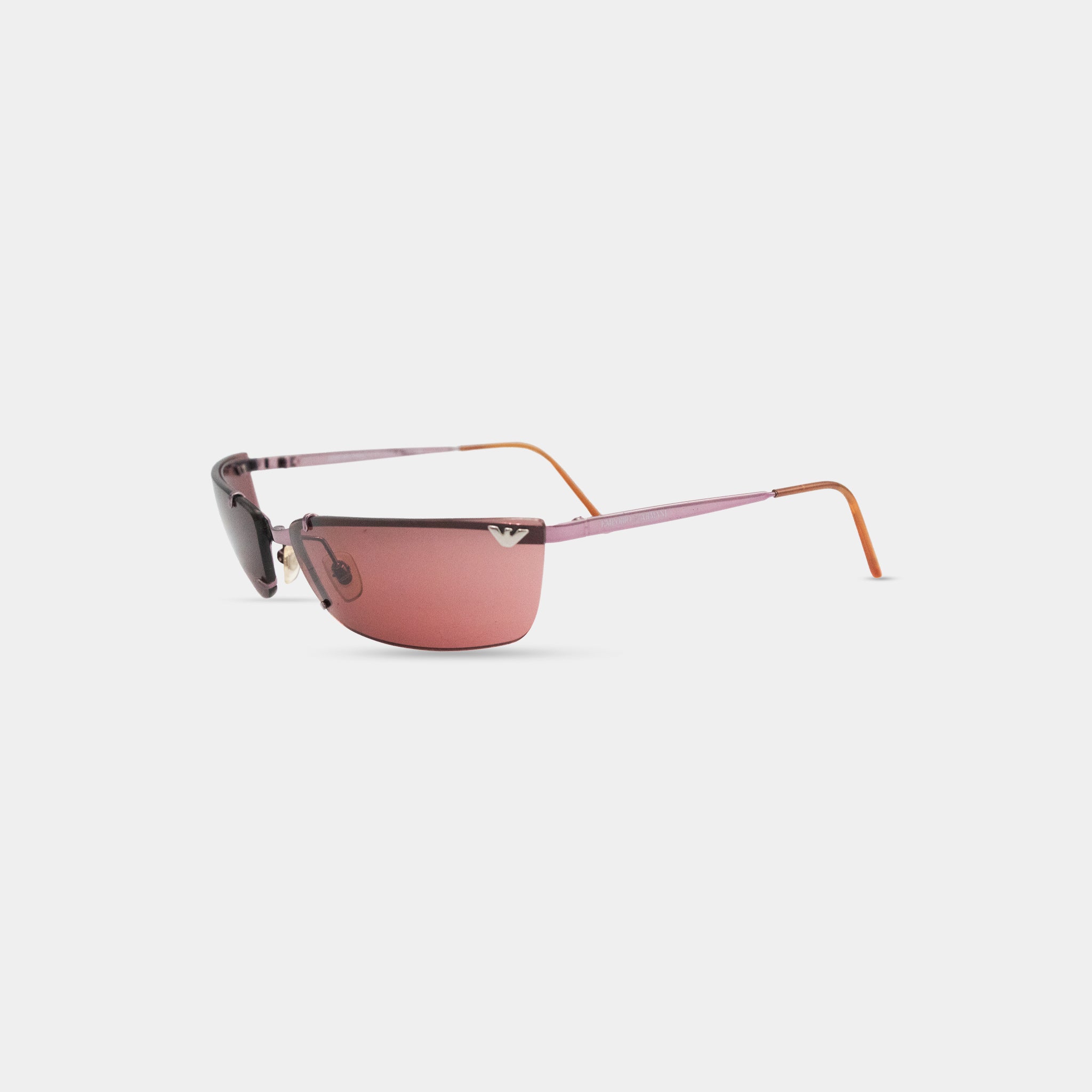 A pair of pink sunglasses with a dark frame, positioned on a white background.
