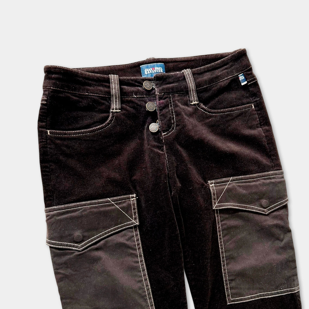 A pair of dark brown velvet pants with a button closure and two pockets.