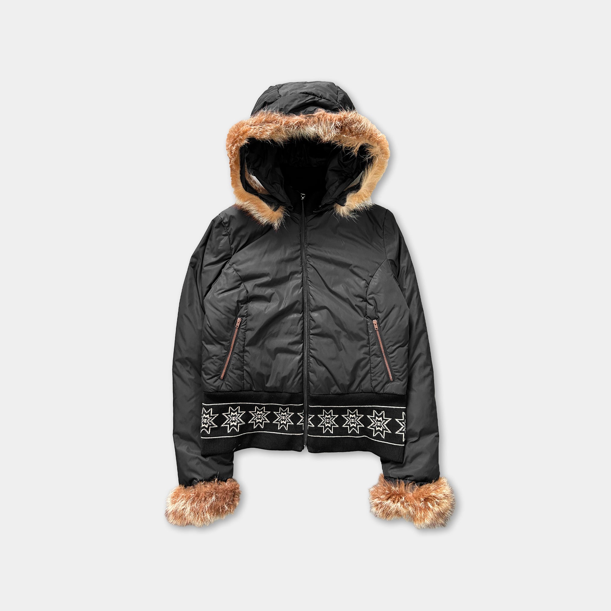 A black hooded jacket with fur trim and a hood, featuring a zipper and decorative snowflake patterns on the front.