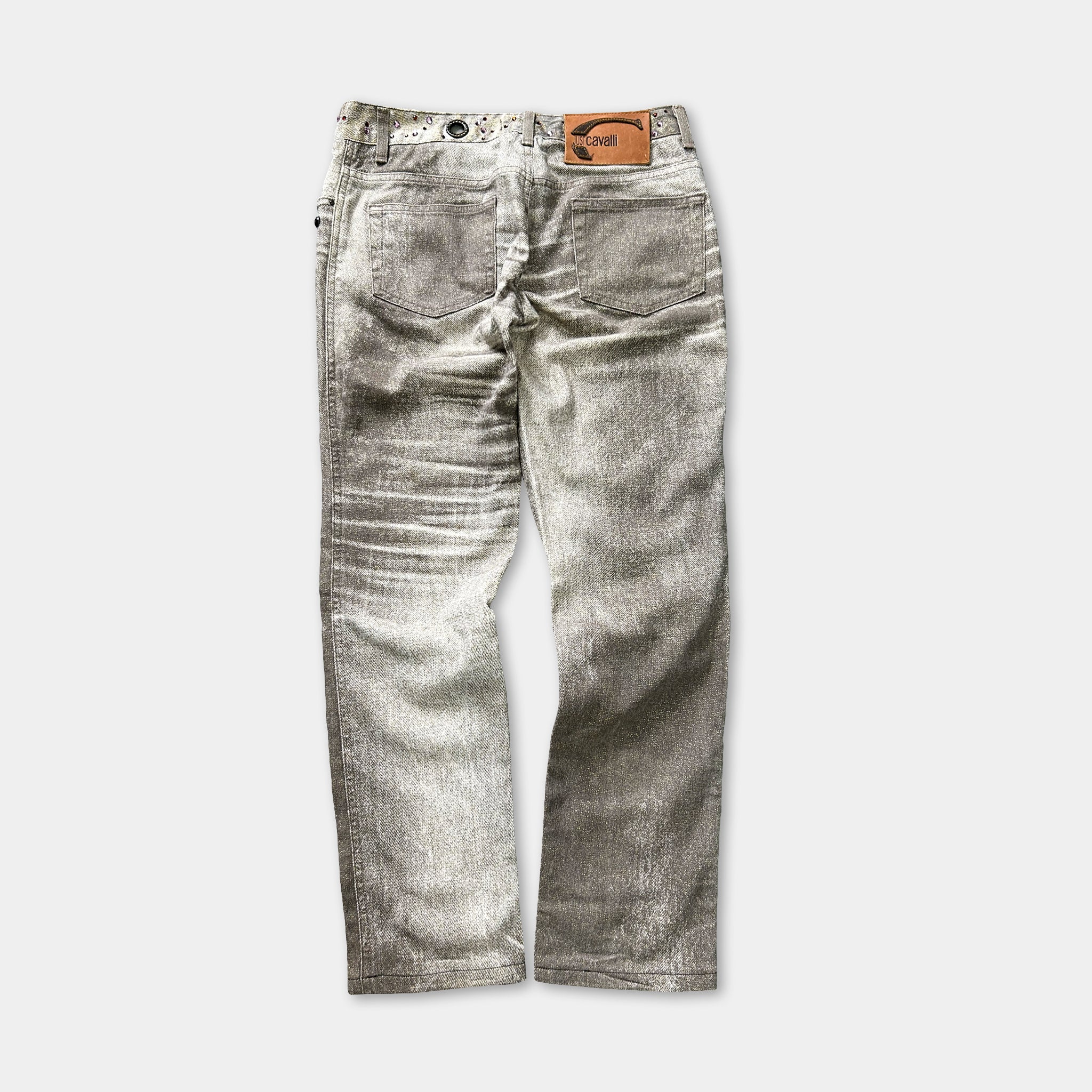 A pair of gray jeans with a leather belt and a small patch on the back pocket.