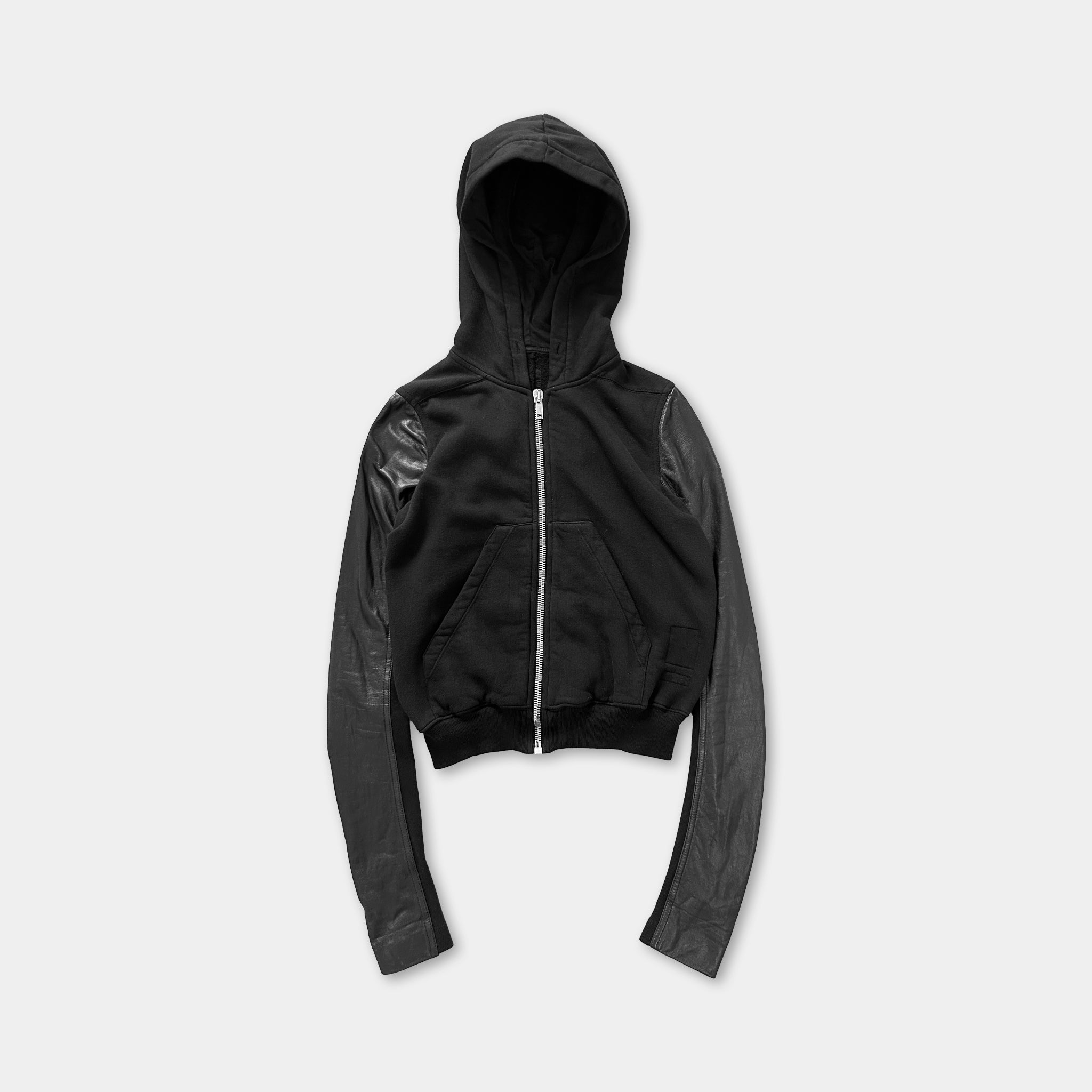A black zip-up hoodie with long sleeves and a front pocket.