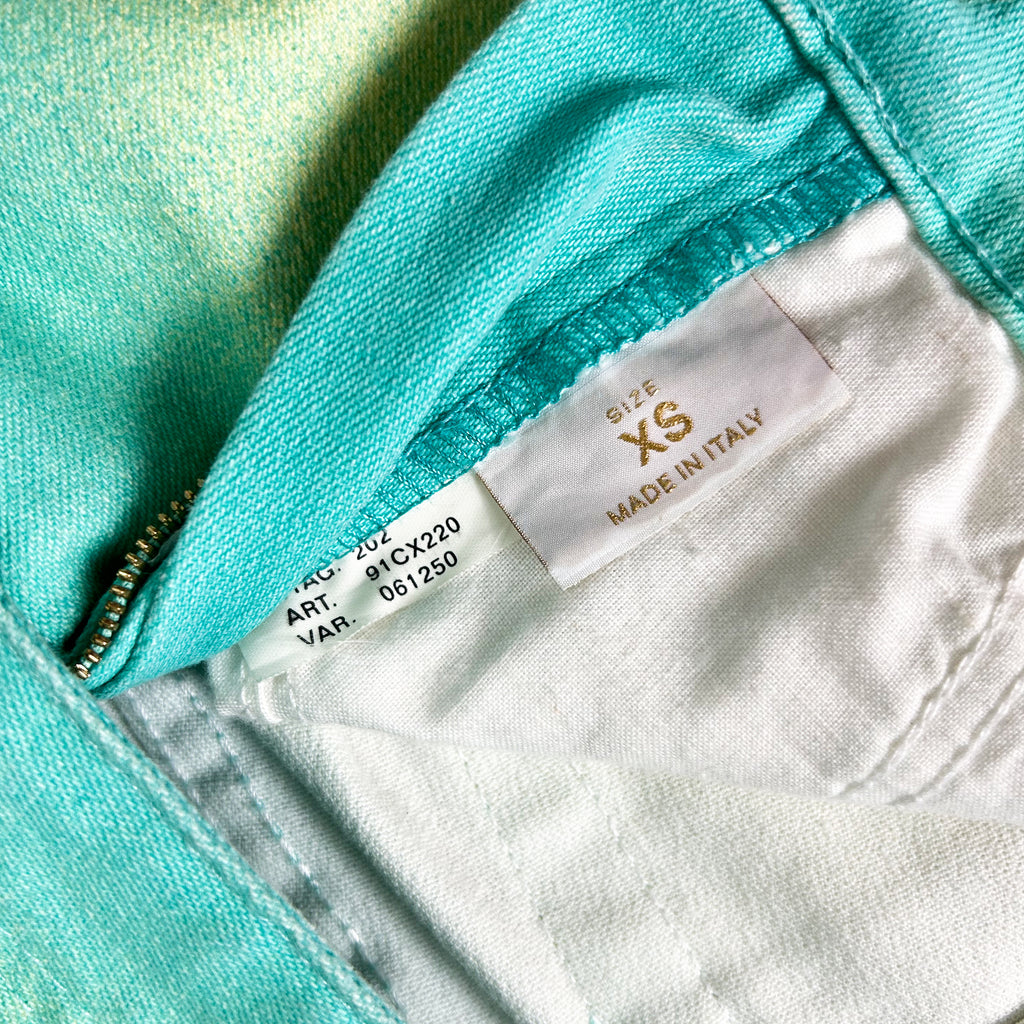 A close-up view of a fabric label, showing the size and material of the clothing item.