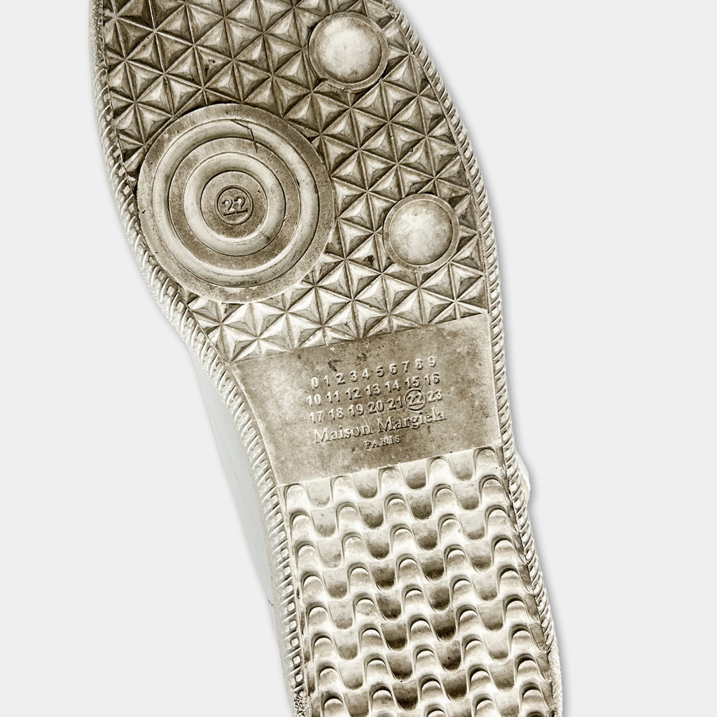the sole of a shoe, with a detailed pattern and some text printed on it.