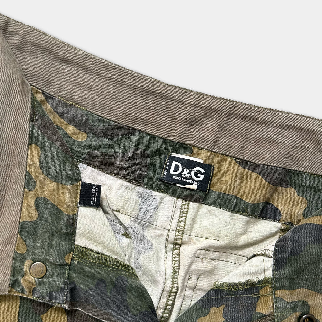 a pair of camouflage pants with a label on the waistband.