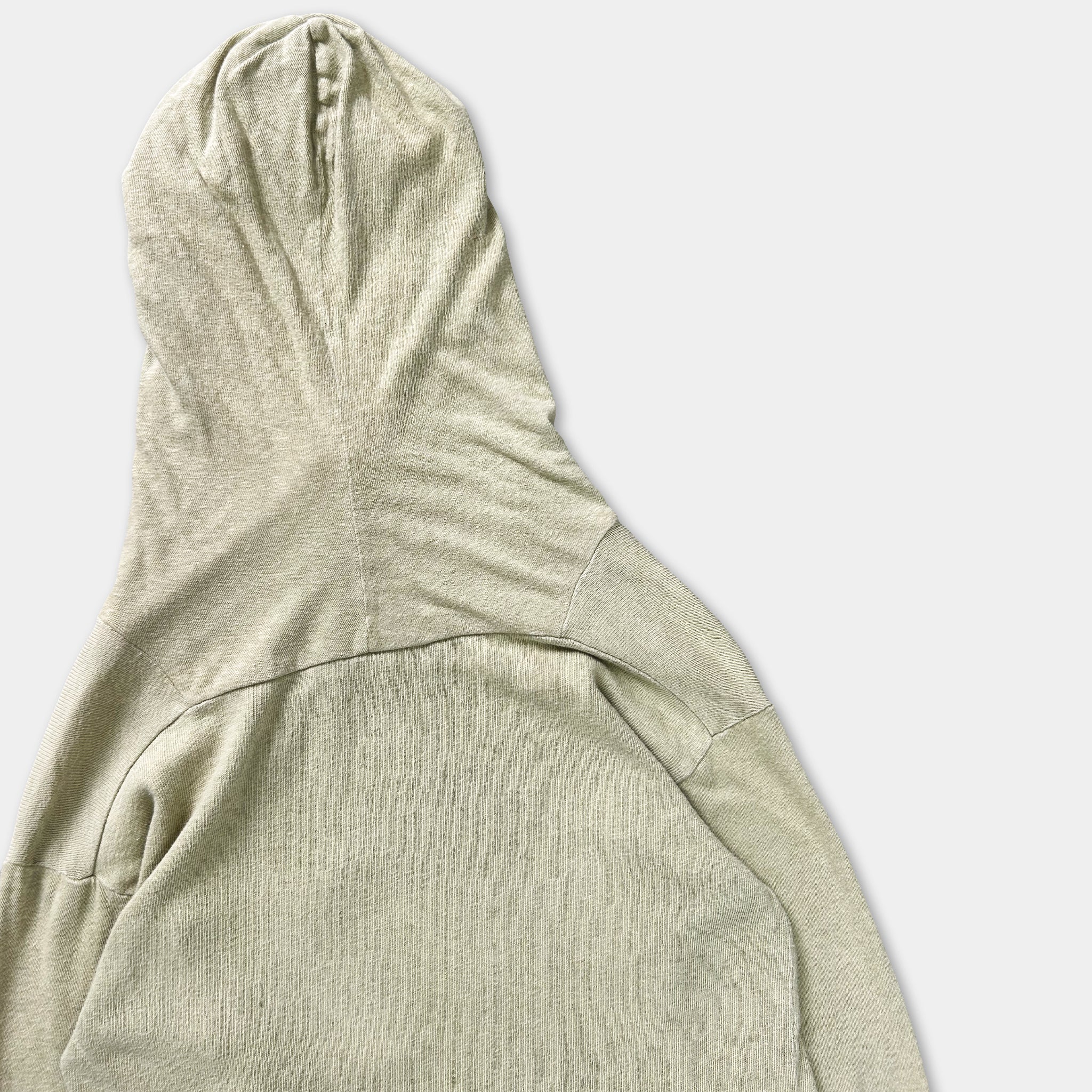A beige hooded sweatshirt is shown against a plain white background.