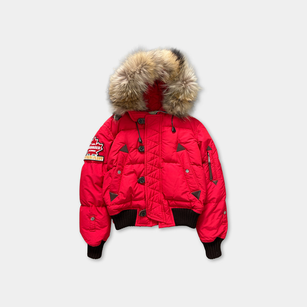 A bright red puffy jacket with a fur-trimmed hood, featuring a zipper and buttons.