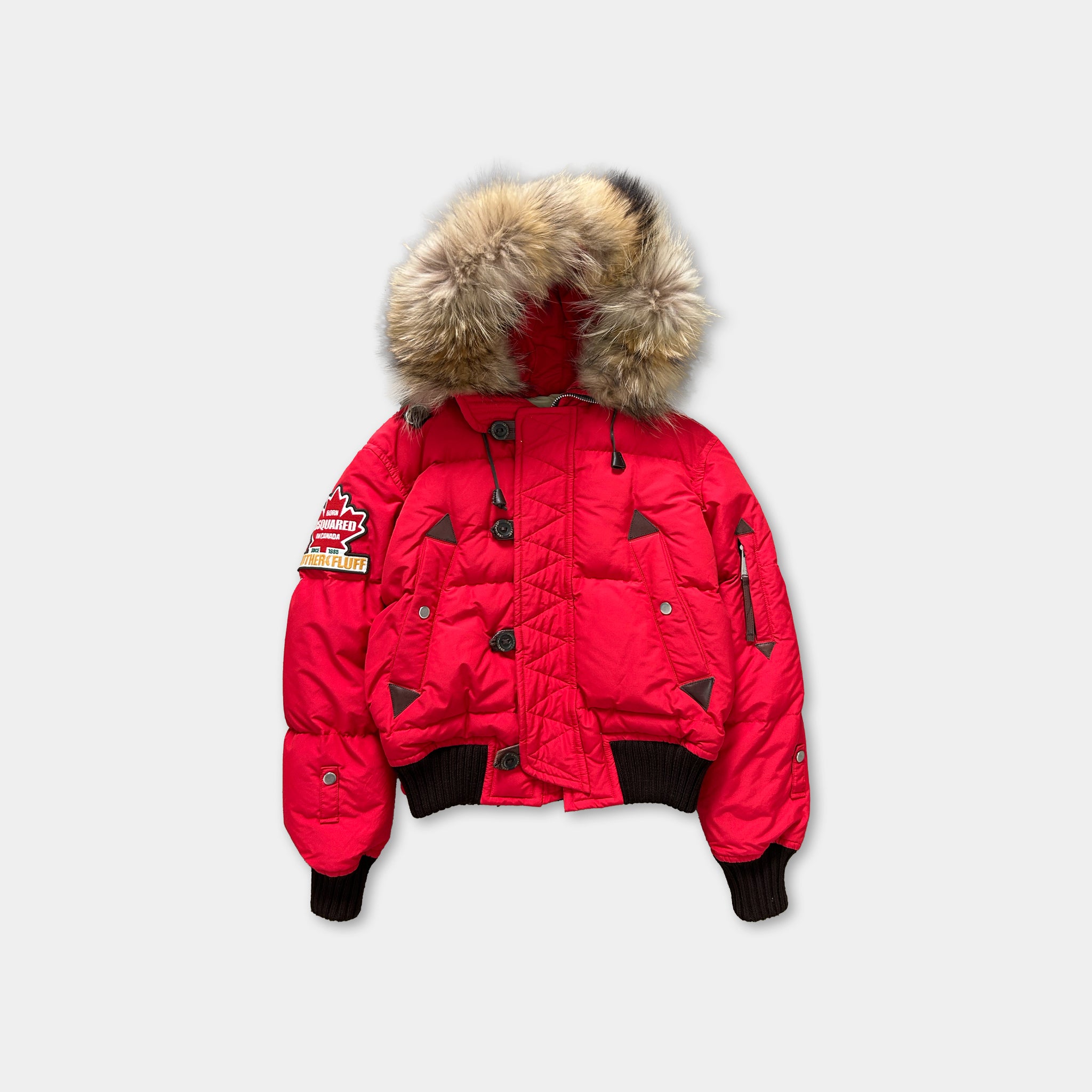 A bright red puffy jacket with a fur-trimmed hood, featuring a zipper and buttons.