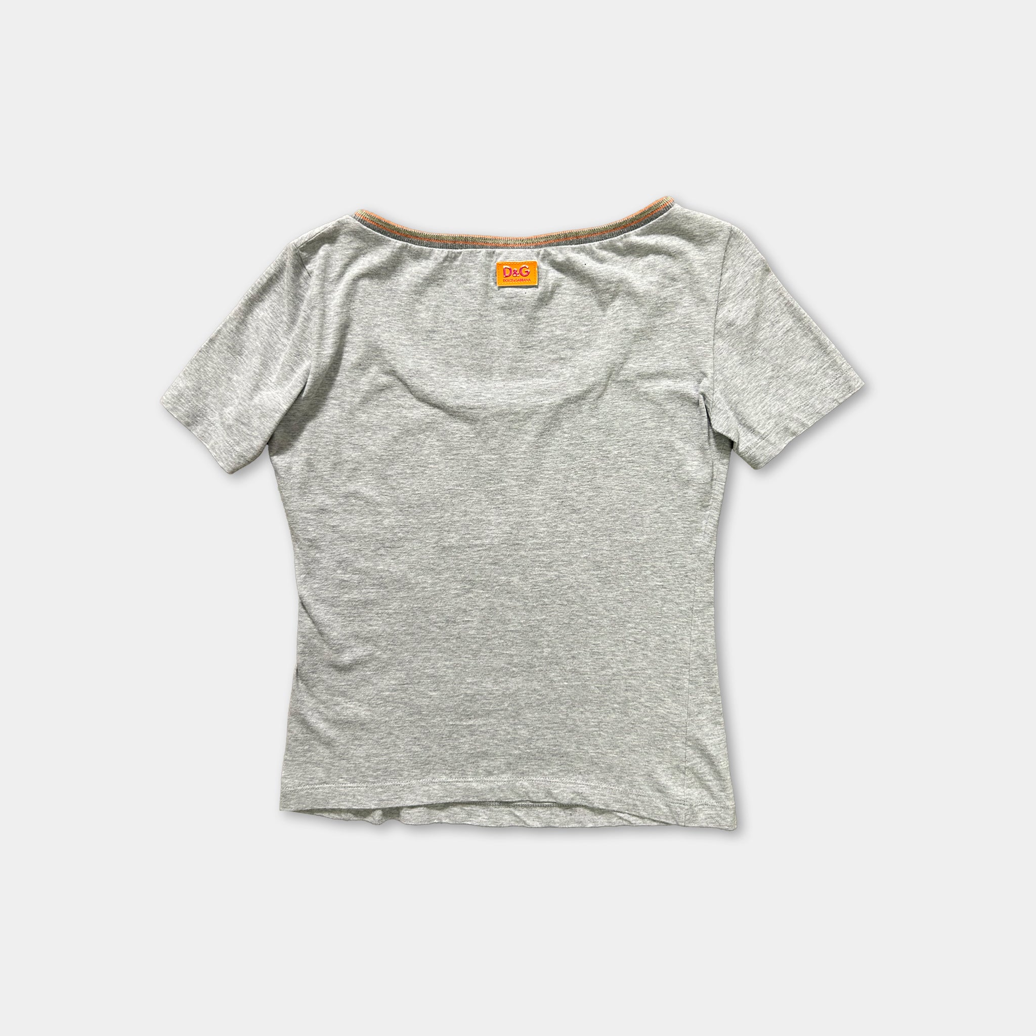 a gray t-shirt with a small orange label on the back.
