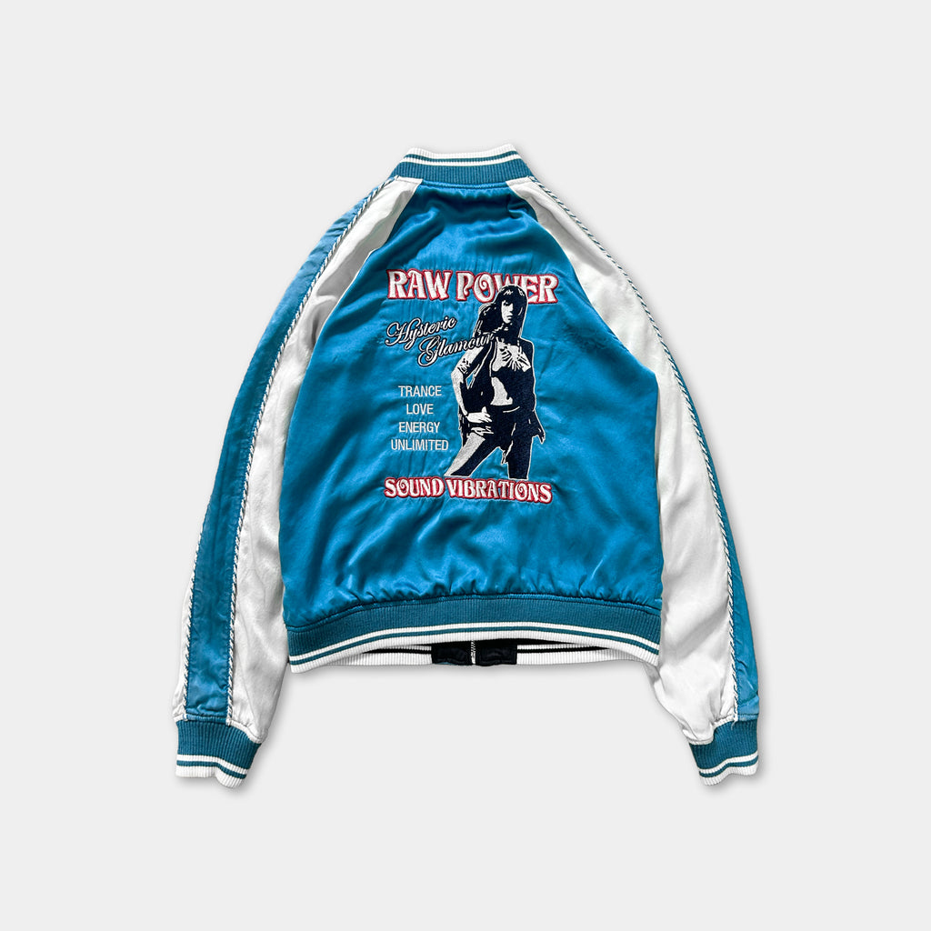 A blue and white jacket with a graphic design on the back.