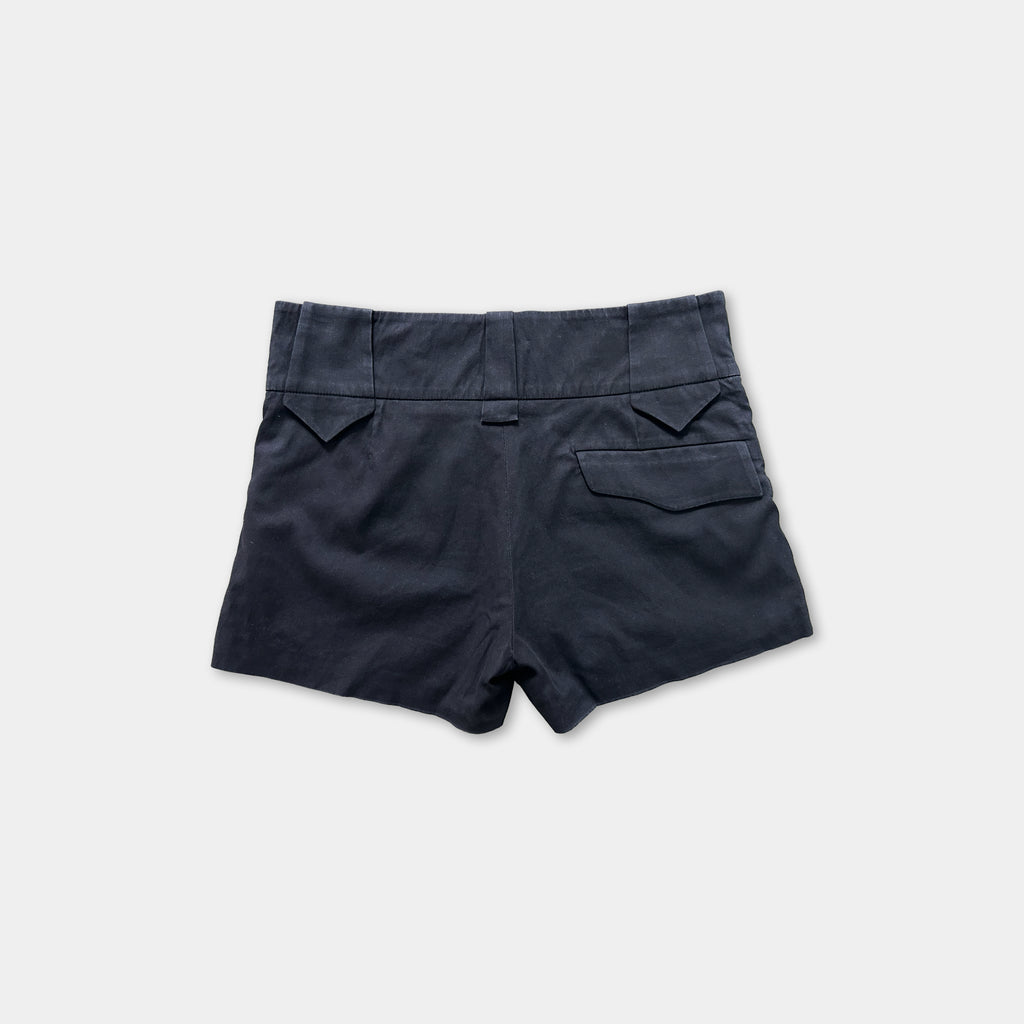 A pair of dark blue shorts with a high waist and a small pocket on the back.