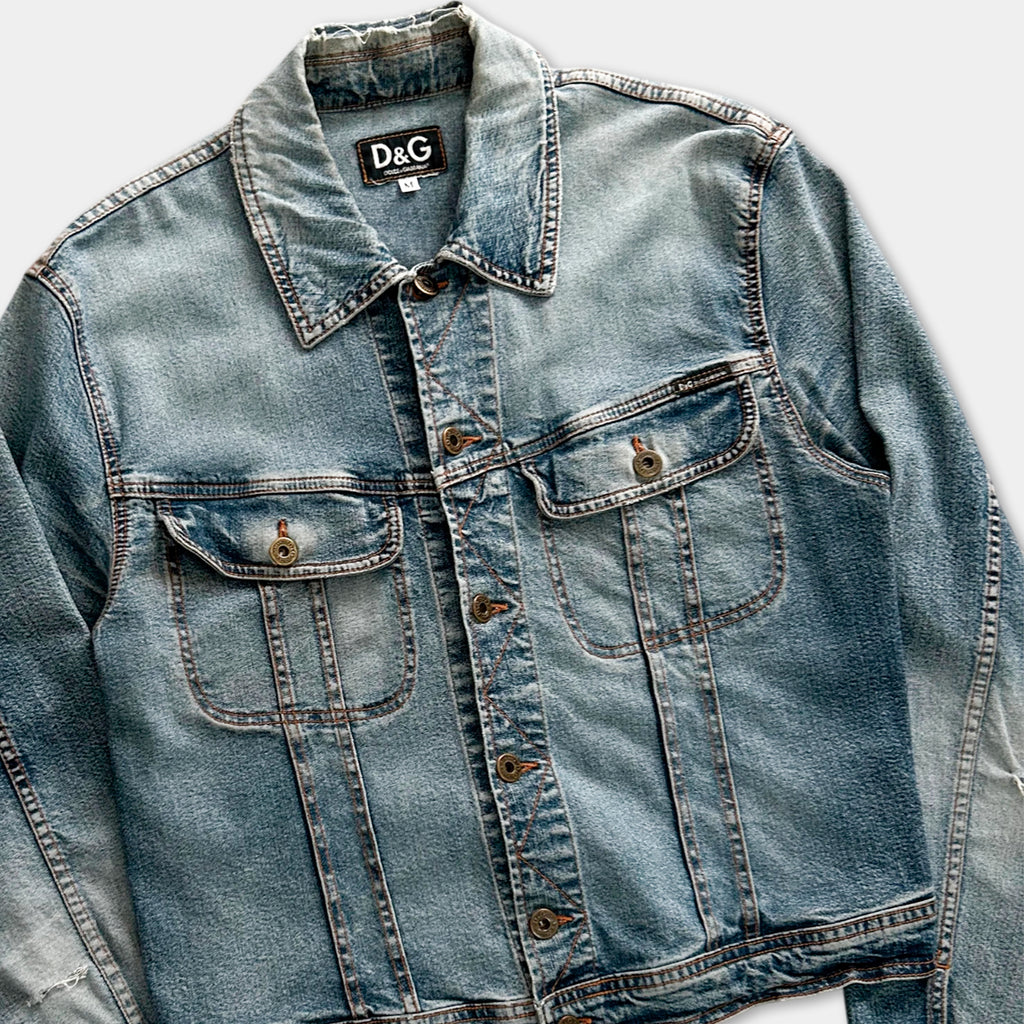 A denim jacket with a collar and button-down front, featuring a classic button-down style.
