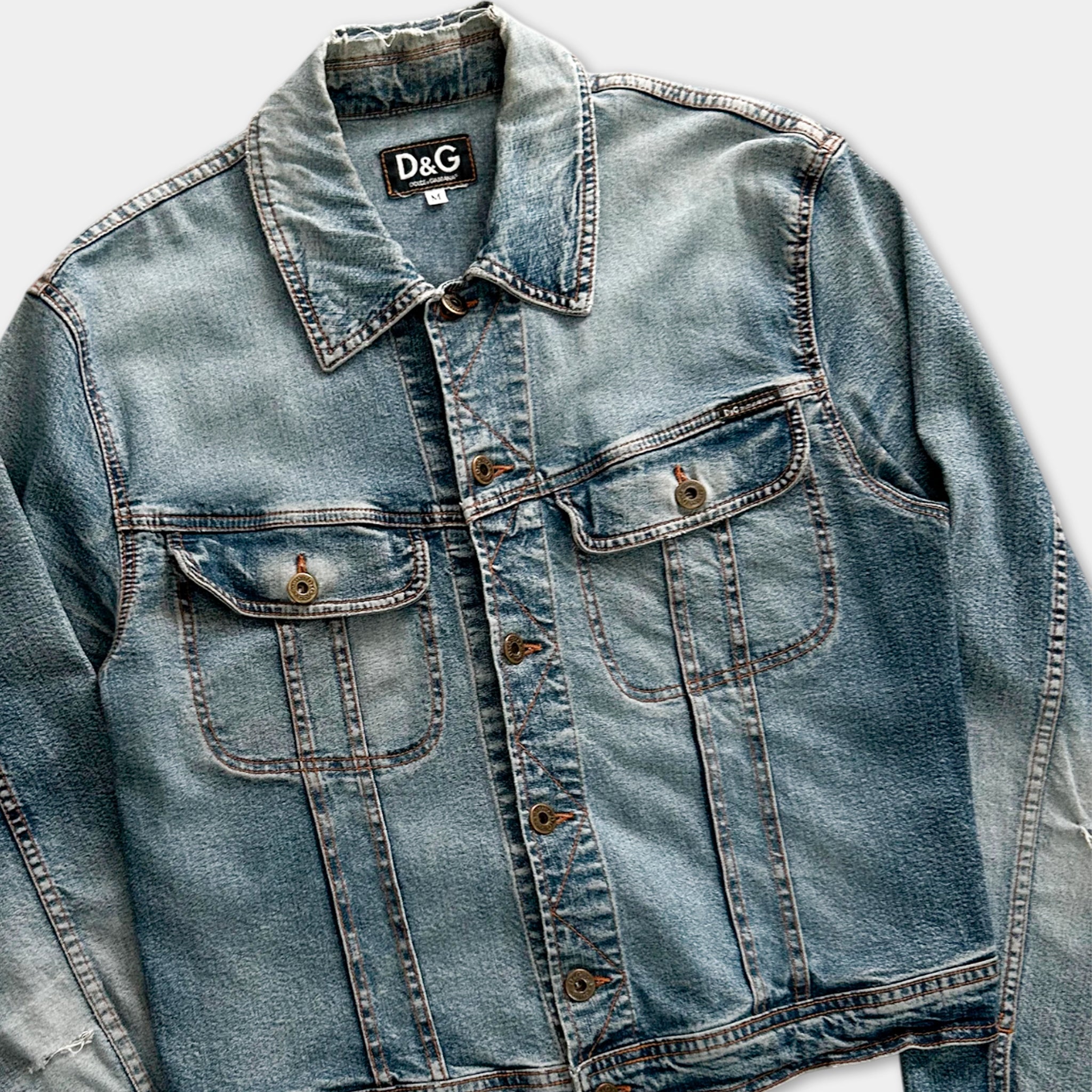 A denim jacket with a collar and button-down front, featuring a classic button-down style.