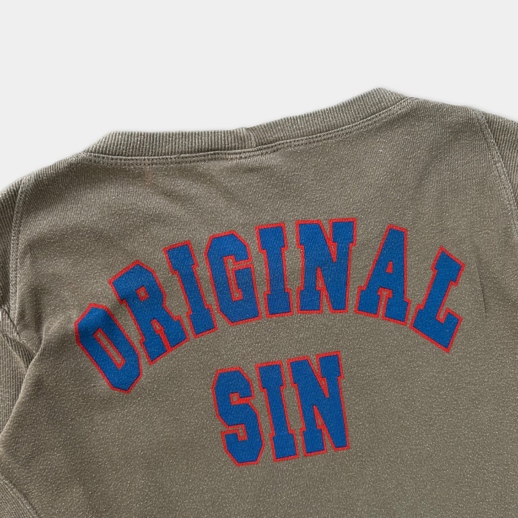 the back of a gray sweatshirt with the text "ORIGINAL SIN" printed in blue and red letters.