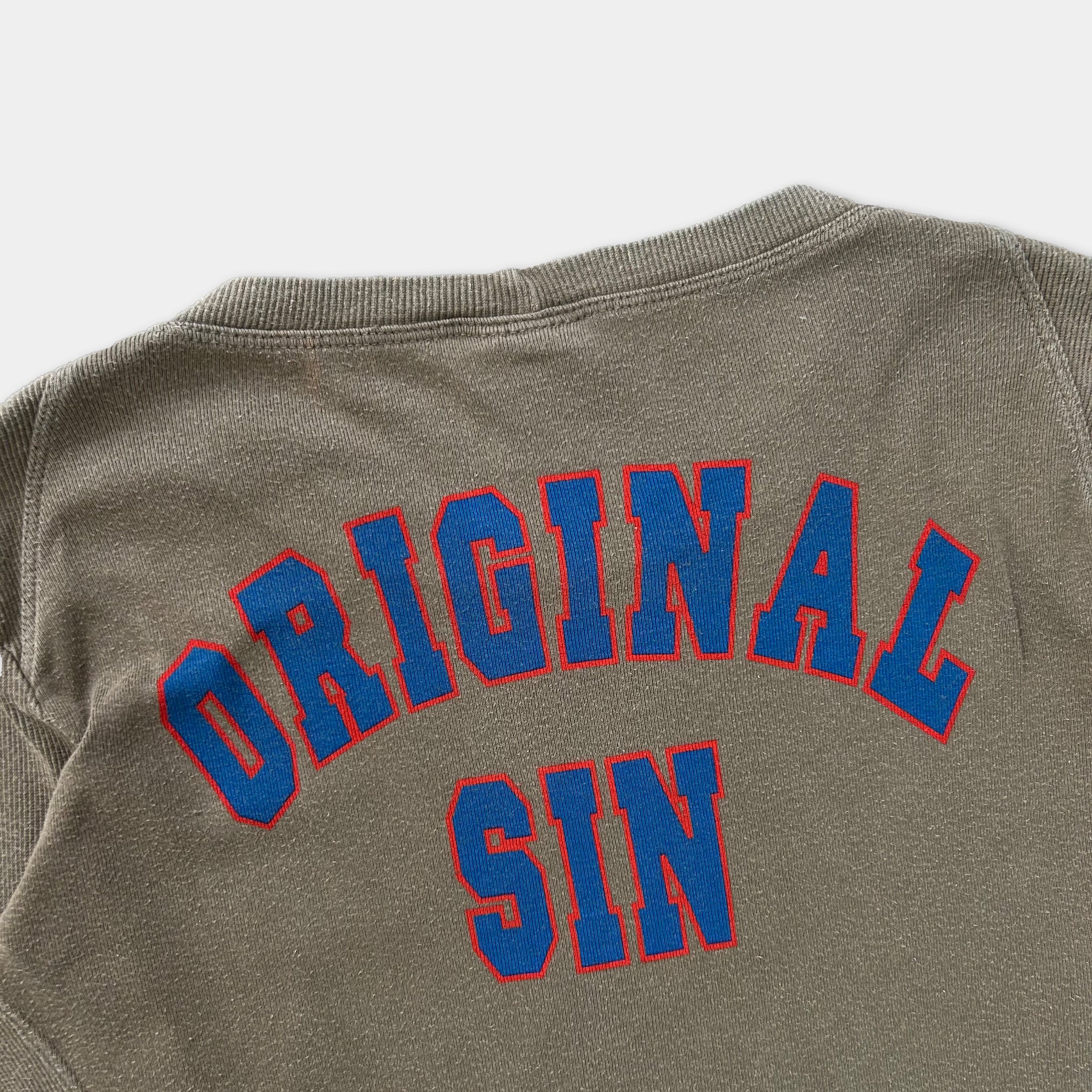 the back of a gray sweatshirt with the text "ORIGINAL SIN" printed in blue and red letters.